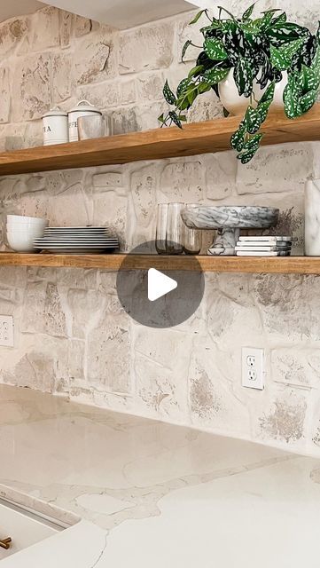 Kelsey Gibby on Instagram: "I’ve always loved the look of stone backsplash in a kitchen but actually seeing it in person and installing it has taken that to a whole different level. Not to mention Karleys selections with it couldn’t have been any more perfect. Really enjoyed tackling this DIY project with one of my friends. Can’t wait to see how the rest of her house turns out!   Stay tuned this week for a full tutorial of the stone installation and floating shelves." Austin Stone Backsplash, Stone Wall Backsplash Kitchen, Kitchen Stone Wall Ideas, Rock Wall In Kitchen, Stone Wall Kitchen Backsplash, Faux Stone Backsplash Kitchen, Rock Backsplash Kitchen, Stone Splashback Kitchen, Kitchen Stone Backsplash Ideas