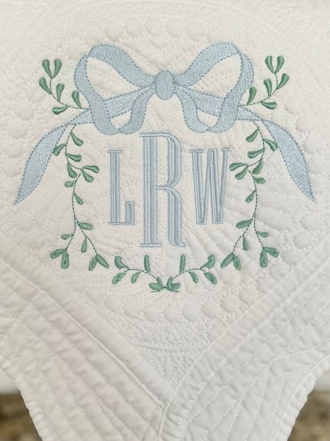 Monogrammed Heirloom quilts are the best addition to any nursery or child's room! They make a perfect bringing home baby gift, baby shower gift or gift for any special occasion.  IMPORTANT  This listing price includes sage green vine with large bow and 3in three letter monogram (first, last, middle format) in the frame. You can choose the color of your initials and bow. Girl font and boy font are as pictured. Embroidery is placed in the corner of the quilt.  Size: 36" x 45" Our most popular quil Baby Monogram Ideas, Three Letter Monogram, Blue Nursery Boy, W Monogram, Baby Boy Monogram, Baby Crib Quilt, Monogram Baby Blanket, Boy Monogram, Nursery Monogram