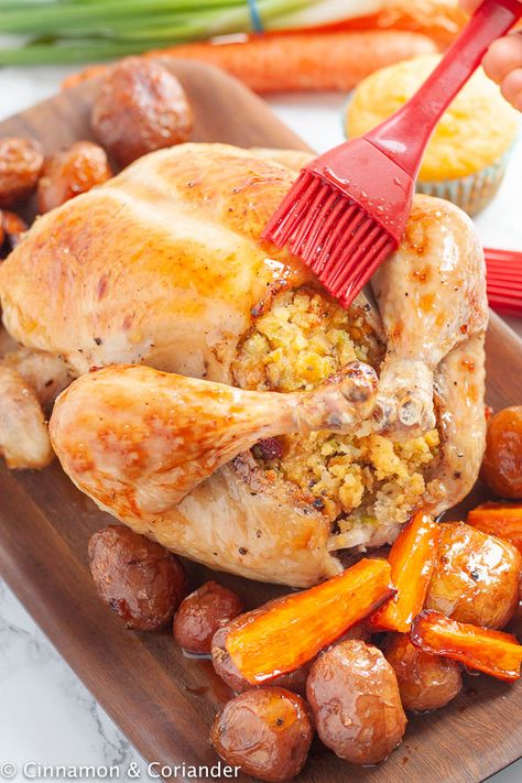 Whole Maple Roast Chicken with Cornbread Stuffing | A savory homemade Southern cornbread stuffing and a quick and easy pan gravy make this whole maple roast chicken with stuffing recipe the perfect dinner for holiday gatherings like Thanksgiving. The best Chicken dinner - ideal for when you have leftover cornbread to use up! #thanksgivingrecipe #chickendinner #stuffing #roastchicken #cornbread Roast Chicken With Stuffing, Southern Cornbread Stuffing, Southern Style Cornbread Dressing, Chicken With Stuffing, Cornbread Stuffing Recipes, Leftover Cornbread, Pan Gravy, With Cornbread, Cornbread Stuffing