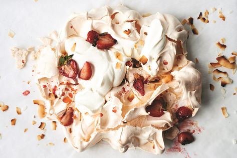 Our 13 Most Popular Dessert Recipes on Pinterest - Epicurious Meringue Pavlova, Macerated Strawberries, Passover Desserts, Meringue Desserts, Egg Shop, Coconut Shavings, Easter Desserts Recipes, Popular Desserts, Easter Dessert