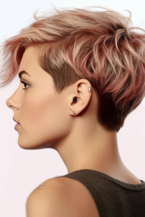 If you want to create contrasting effects with your hairstyle, go for the voluminous pixie shag with an undercut. The undercut adds a touch, while the voluminous top layers provide fullness and volume to your hair. Click here to check out more beautiful short shaggy haircuts for fine hair. Short Pixie Haircuts Back View, Short Undercut Hairstyles For Women Fine Hair, Undercut Pixie Haircut For Fine Hair, Short Hair Long On Top For Women, Undercut Faux Hawk Woman, Back Of A Pixie Haircut, Shag Haircut With Undercut, Feminine Undercut Short Hair, Shaggy Pixie Cuts For Fine Hair