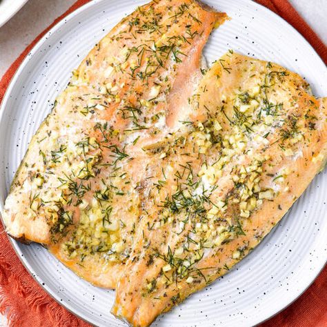 Baked Rainbow Trout With Garlic Butter - Cooked & Loved Fresh Trout Recipes Baked, Baked Rainbow Trout Recipe, Trout Recipes Baked, Rainbow Trout Recipe Baked, Steel Head Trout Recipes, Baked Rainbow Trout, Trout Fillet Recipes, Rainbow Trout Recipe, Baked Trout