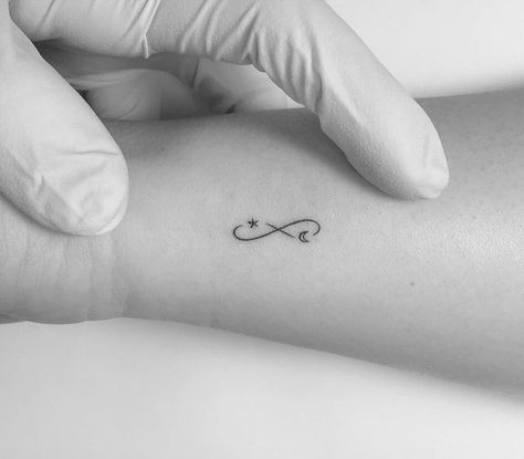 Infinity symbol with moon and star tattooed on the wrist Eternity Tattoo, Small Infinity Tattoos, Infinity Sign Tattoo, To The Moon And Back Tattoo, Tattoo Infinity, Infinity Tattoo On Wrist, Tiny Tattoo Ideas, Infinity Symbol Tattoo, Small Star Tattoos