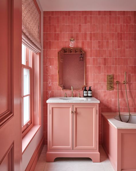 While we still retain a soft spot for simple interiors we love when designers go bold with colour. This pink bathroom by @taylorandturner for example is a maximalist feast for the eyes. The beautiful tiles match perfectly with the vanity in @edwardbulmerpaint ‘Brick’. Brass hardware and accessories elevate the space and add extra flair. Specialising in private residential and commercial design, @taylorandturner offers an honest and straightforward approach, delivering elegant homes and space... Bathrooms Pink Tiles, Pink Feature Tile Bathroom, Pink Bathroom Maximalist, Pink Tadelakt Bathroom, Pink Tiles Ensuite, Maximalist Bathroom, Colourful Bathroom, Cupboard Paint, Bold Bathroom