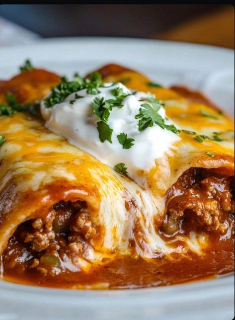 Savor the comforting taste of these Cheesy Ground Beef Enchiladas, a delightful Mexican-inspired meal featuring perfectly seasoned beef, gooey cheese, and a luscious sauce. Ground Beef Recipes For Dinner Easy Mexican Enchilada Casserole, Cheesy Beef Quesadilla Recipes, Best Ground Beef Enchilada Recipe, Smothered Enchiladas Ground Beef, Beef Enchiladas With Rice, Enchilada Ground Beef, The Best Beef Enchiladas Ever, Best Enchilada Recipe Beef, Beef Enchilada Recipe Easy