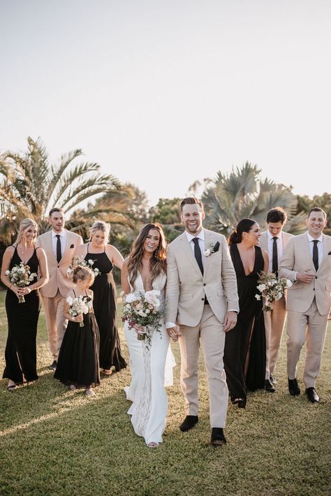 Captured at the stunning Baja Luna, this wedding exudes elegance and joy. The bridesmaids' black dresses and the groomsmen's beige suits complement the natural backdrop beautifully. The lush greenery and tropical palm trees add a touch of paradise to this unforgettable day. #BajaLunaWedding #DestinationWedding #WeddingParty #ElegantWedding #OutdoorWedding #WeddingPhotography #BridalBouquet #TropicalWedding Bridesmaid Dresses Palette, Hilton Los Cabos, Mendoza Wedding, Tan Suits, Welcome Cocktail, Tropical Palm Trees, Black Bridesmaid, Beige Suits, Wedding Vision Board