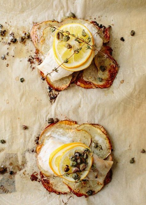 Recipe: Lemon-Herb Fish Fillets on Crispy Potato Rafts — Weeknight Dinner Recipes from The Kitchn | The Kitchn Baked Fish In Foil, Party Main Course, Dinner Party Main Course, Dinner Party Mains, Baked Fish Fillet, Fish Fillets, Cod Recipes, Lemon Herb, White Fish