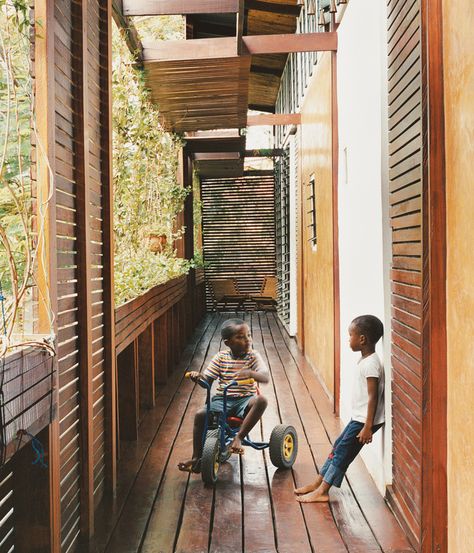 The wraparound balcony is a playground for four-year-old Kwaku; there he plays soccer, chases the family’s four dogs, and hangs out with ... Dwell Magazine, House Balcony, African Interior, Green Architecture, Accra, Green Building, Ghana, Balcony, Beautiful Homes