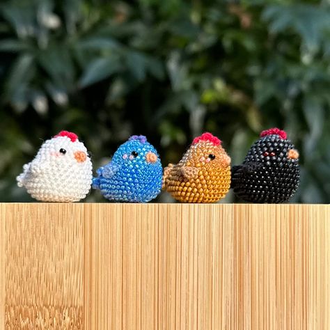 These blushing mini chickens are made to order, with a wide variety of color options. The first 9 color options have different colored beads for the head and body. If you want your chicken to be one solid color, choose from color options 10 through 36. You also have the option to add a keychain to your chicken.  *If you would like a color combination not listed, message me! We can find the perfect colors for you!* The chickens are bead crocheted using a 0.9 mm hook and 2 strands of cotton embroidery thread. Measurements: Chicken is 2.5 cm tall, 2.5 cm wide. Total height including keychain is 7.5 cm. Keychain has a 2.5 cm diameter hoop. ** Disclaimer: This chicken keychain contains small beads and should not be used for or by children or animals. ** Bead Embroidery Keychain, Bead Crochet Amigurumi, Seed Bead Keychain, Beaded Chicken, Chicken Keychain, Beaded Animals Tutorial, Thread Crafts, Seed Bead Projects, Beaded Charms