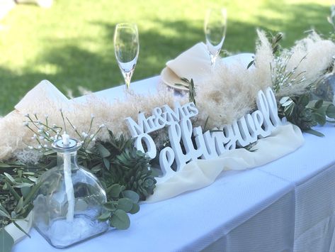 Bride & Groom Table w olive and seeded eucalyptus garland, pampas grass and patron bottle table torches. Bride Groom Table, Patron Bottle, Rustic Wedding Showers, Eucalyptus Garland, Seeded Eucalyptus, Gettin Hitched, Neutral Wedding, Long Table, Pampas Grass