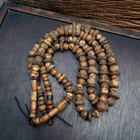 Vintage Trade Tibetan Carving Beads Beaded Necklace This vintage Tibetan beaded necklace boasts a beautiful array of multi-colored stone beads, with intricate carvings and a style that is sure to catch the eye. The beads themselves were handcrafted and traded in Asia, making them a unique and rare find for any collector. Dating from 1800-1950, this strand of beads is a testament to the rich history and cultural exchanges that defined this period. Perfect for those who appreciate the beauty of Traditional Carved Adjustable Beaded Necklaces, Dzi Beads Necklaces, Tibetan Necklace Nepal, Tibetan Jewelry The Little Tibet, Trade Beads Antique, Colored Stone, Stone Beads, Multi Colored, Stone Color