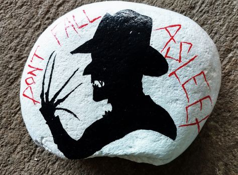 Freddy Krueger rock painting Freddy Krueger Painted Rocks, Freddy Krueger Pumpkin Painting, Fall Rocks, Rock Animals, Fall Rock, Painted Rock Animals, Pumpkin Designs, Halloween Rocks, Rock Gardens