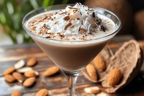 Indulge in a creamy Almond Joy Martini! This rich cocktail blends chocolate, coconut, and almond flavors for a luxurious dessert drink. Almond Joy Martini Recipe, Coconut Martini, Martini Ingredients, Chocolate Martini, Herbalife Recipes, Beet Recipes, Chocolate Liqueur, Vanilla Vodka, Chocolate Swirl