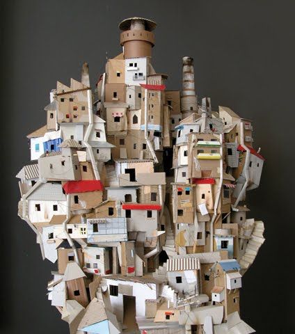 Dutch artist Benjamin Van Oost, co-founder of design company Toykyo, has created a miniature favela with his girlfriend Annelies. The "sculpture is made entirely of trash — recycled boxes, pieces o... Cardboard City, Cardboard Sculpture, Paper City, Craft Kids, Cardboard House, Cardboard Art, Recycled Art, Paper Houses, Cardboard Crafts