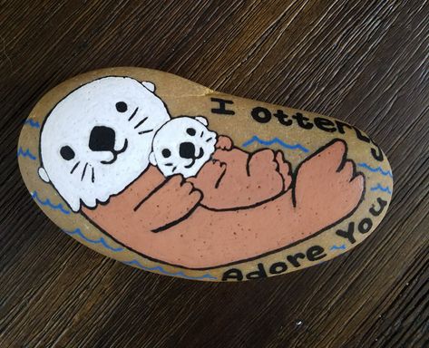 Otter rock painting by Rebeca Page Otter Painted Rocks, Otter Rock Painting, Decorated Rocks, Rock Sayings, Labrador Silhouette, Painting Stones, Diy Rock Art, Paint Rocks, Happy Stones