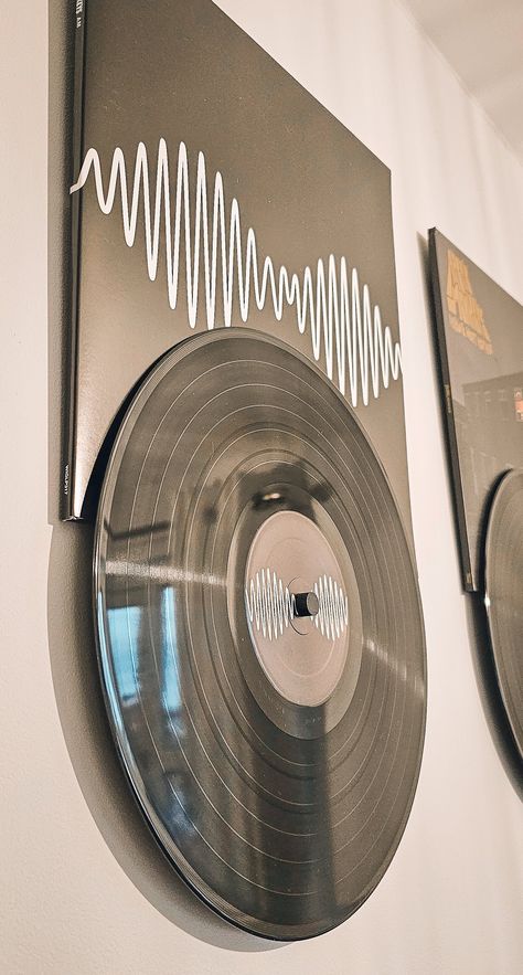 "Introducing \"Record Roll\" - the innovative and stylish way to display your favorite vinyl records on your wall!  Each Record Roll is carefully 3D printed with precision and care, ensuring a high-quality finish that will last for years to come. The Record Roll is designed to hold your vinyl record securely in place. Whether you want to showcase your vintage vinyl collection, or display your favorite new releases, the Record Roll is the perfect choice for any music lover. Not only does the Record Roll look great on your wall, but it's also incredibly easy to install. Simply mount it on any wall using the included hardware, and you're ready to go! And if you ever need to change up your display, the Record Roll makes it easy to swap out your vinyl records in just seconds. So why settle for Vintage Record Collection, Records Display Wall, Vynil Record Display, Old Album Covers Vinyl Records Wall Art, Diy Vinyl Display, Vinyl Record On Wall, Vynil On Wall, Vinyl Record Room Decor Wall Art, Hanging Vinyls