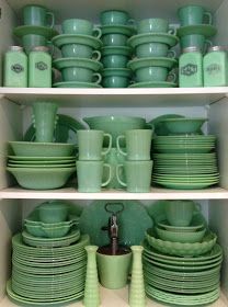 "In the 1940s and 1950s, jadeite - a stain- and heat-resistant, milky-green glassware - was quite common and sold in hardware stores and five-and-tens. Sometimes a piece of jadeite would be included in a bag of flour or a box of oatmeal as an inducement to the consumer to buy the rest of the set. Today, jadeite is a popular - and valuable - collectible. A ball jug that once sold for $5 could sell for as much as $5,000 today." Green Dishes, Cocina Shabby Chic, Plates And Cups, Kitchen Retro, Green Glassware, Décor Boho, Vintage Kitchenware, Shabby Chic Kitchen, Cool Ideas