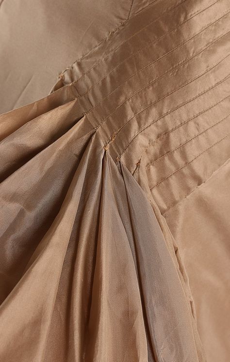 Roberto Capucci taupe taffeta ball gown, 1956, with narrow woven label, the skirt, cut shorter at the front to reveal the ankles, with cross-banded waist panels which cascade in bouffant drapes to the trained hem, adorned with large velvet bow, the strapless bodice with velvet edging. Roberto Capucci, Moving To Paris, Woven Label, Velvet Bow, Dinner Parties, Sewing Techniques, Ball Gown, Ball Gowns, Bodice