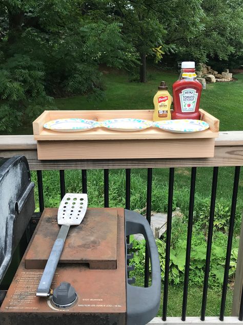 "Tired of not having room near your BBQ grill for all the items you need to cook with? This deck rail table helps to solve that issue. Made of 100% cedar, the Deck Railing Table will be made to order. It's made to fit over a standard 6\" deck rail. If needed, we can customize the width to accommodate a smaller or larger railing. The table can be stained to just about any color and clear coated to help protect it from the elements. Table will be 30\" long, 11.5\" wide and fits over a standard 6\" Cute Deck Decorating Ideas, Camper Deck Decorating Ideas, Front Deck Decorating Ideas, Deck Railing Table, Blackstone Table, Apartment Flip, Deck Gates, Railing Table, Bbq Deck