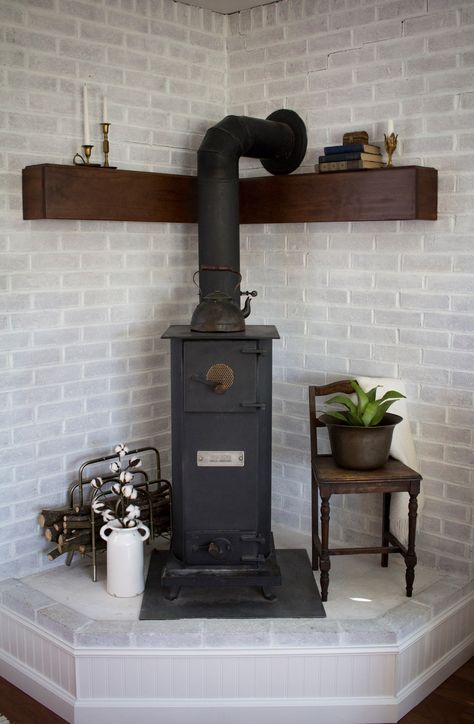 Corner Hearth Makeover Brick Wood Stove Hearth, Pellet Stove Ideas Corner, Corner Pellet Stove Ideas Living Rooms, Stove Makeover, Hearth Makeover, Corner Hearth, Pellet Stove Hearth, Wood Stove Decor, Wood Burning Stove Corner