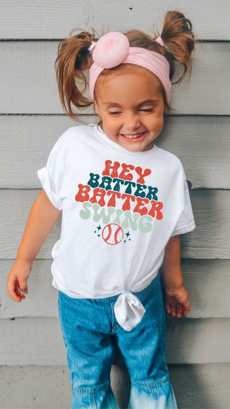 Toddler Hey Batter Batter Swing Shirt, Mommy & Me, Toddler Baseball Shirt - Toddler Baseball Graphic Tee,Baseball Shirt,Distressed Print,kids baseball tee,kids baseball shirt,hey batter,batter swing,baseball shirt,baseball sports tee,toddler baseball,youth baseball,kids baseball,ballgame shirt,ballpark shirt,boys baseball,girls baseball tee Uplift any child's wardrobe with a custom kid's t-shirt. The Bella Canvas short sleeve tee for toddlers is a 100% Airlume combed and ring-spun cotton jersey with a tear-away label for extra comfort. Choose your favorite color out of a big variety, and make unique staples that toddlers will happily wear every day. \n.: 100% Airlume combed and ringspun cotton (fiber content may vary for different colors)\n.: Extra light fabric (3.9 oz/yd² (132 g/mn.: Tear Toddler Baseball Shirt, Baseball Fundraiser, Baseball Mom Outfits, Baseball Kids, Sporty Mom, Hey Batter Batter, Baseball Graphic Tees, Girls Baseball, Toddler Graphic Tee