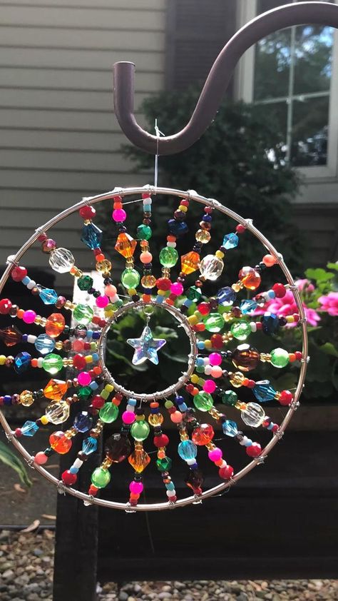 Beaded sun catcher | Diy wind chimes, Hanger crafts, Yard art crafts Sun Catcher Diy, Beaded Sun Catcher, Carillons Diy, Diy Para A Casa, Suncatcher Diy, Diy Suncatchers, Wind Chimes Craft, Hanger Crafts, Diy Wind Chimes