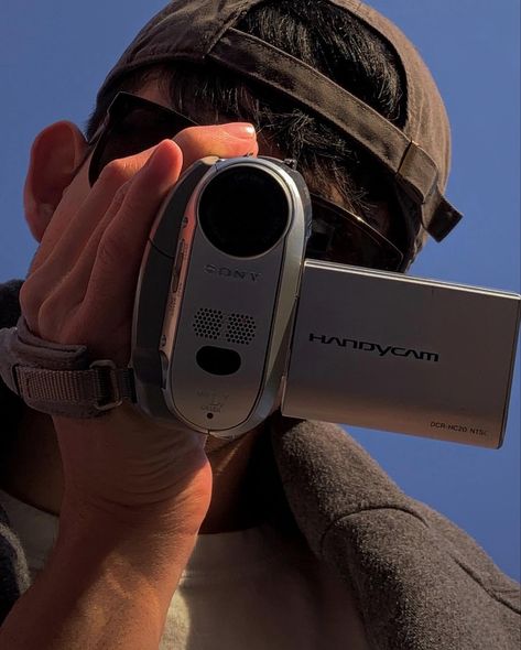 Man in a baseball cap playing with a 2000’s Sony handycam Handycam Aesthetic, Gaming Tech, Daft Punk, Creative Instagram Stories, Camcorder, Summer Aesthetic, Instagram Story, Photography Poses, Vision Board