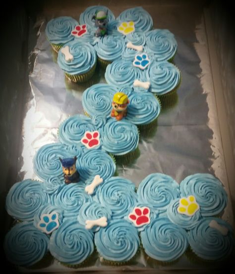 Paw Patrol pull apart cupcake cake in shape of number 2. Paws and bones I made from fondant. Cupcakes In Shape Of 2, 2 Shaped Cupcake Cake, Number 2 Pull Apart Cupcake Cake, 2 Cupcake Cake Number, Paw Patrol Cupcake Cake, Paw Patrol Ideas, Pull Apart Cupcake, Paw Patrol Cupcakes, Rodjendanske Torte