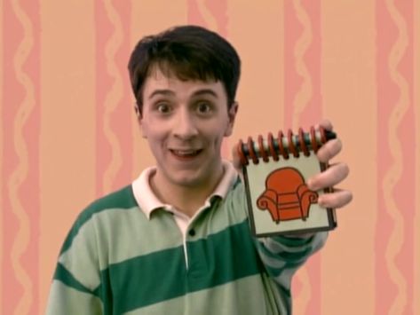 Steve is holding up his handy dandy notebook for Blue's clues. Steve From Blues Clues, Blues Clues Notebook, Blues Clues Handy Dandy Notebook, Blues Clues Steve, Steve Blues Clues, Steve Burns, Handy Dandy Notebook, Pony Videos, Blue Snacks