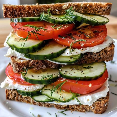 🥒🍅 A refreshing, crisp sandwich packed with flavor! #CucumberTomatoSandwich #FreshBites 🍽️ Cucumber Tomato Sandwich 🛒 Ingredients: 4 slices whole-grain bread 1 cucumber, sliced 2 tomatoes, sliced 1/4 cup cream cheese 1 tbsp fresh dill, chopped Salt & pepper to taste 👩‍🍳 Instructions: Prepare Spread: In a bowl, mix cream cheese, dill, salt, and pepper. Assemble Sandwiches: Spread cream cheese mixture on each slice of bread. Layer cucumber and tomato slices. Serve & Enjoy: Cut sandwiches in... Crisp Sandwich, Dill Salt, Cucumber And Tomato, Instagram Recipes, Grain Bread, Twisted Recipes, Sandwich Ingredients, Cucumber Sandwiches, Tomato Sandwich