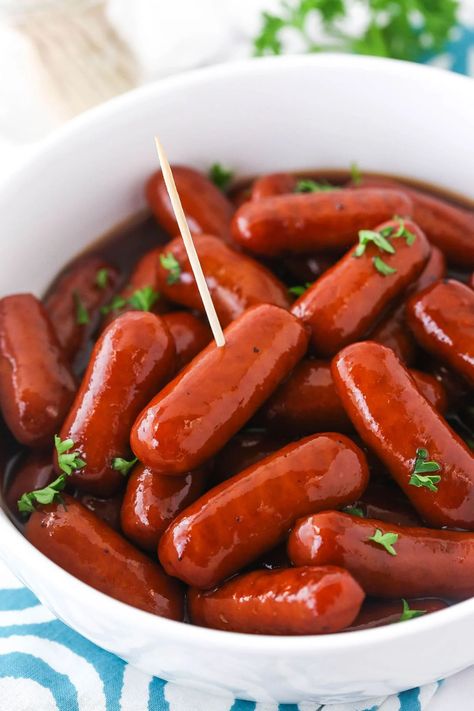 Slow-cooked in a sumptuous mixture of grape jelly and BBQ sauce, these easy Crockpot Little Smokies are a standout snack or appetizer! With just 3 ingredients and 5 minutes of prep time, they couldn't be easier to make. Grape Jelly Little Smokies, Mini Hot Dog Recipes, Crockpot Little Smokies, Cocktail Weenies, Little Smokies Recipes, Smokies Recipe, Sausage Appetizers, Blueberry Jelly, Little Smokies