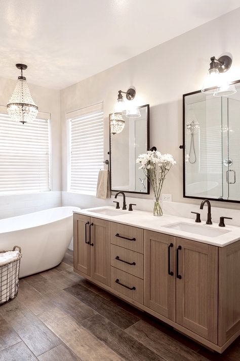 Aesthetic Bathroom Double Sink, Beach Themed Interior Design, Built Ins In Bathroom Master Bath, French Country Farmhouse Interior Design, Black And Stainless Steel Bathroom, Guest Bathroom Tile Wall, Wood Vanity With Wood Floor, Modern Neutral Home Interior Design, Wood Lvp In Bathroom