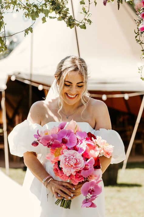 Laughing bride holding bright pink bouquet with orchids and roses Floral Wedding Dress With Bouquet, Bright Orchid Bouquet, Bright Bride Bouquet, Bright Bridal Flowers, Elegant Wedding Vibes, Bright Bridesmaid Bouquet, Sunset Bridal Bouquet, Bright Bouquet Wedding, Bright Pink Wedding Flowers