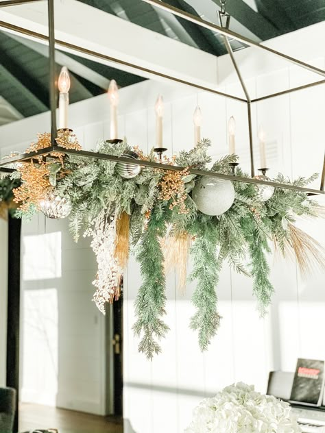 Christmas Dining Light Decor, Christmas Decor On Chandelier, Holiday Chandelier Decor, Chandelier Decorations For Christmas, Cozy Chandelier, Decorating Chandeliers For Christmas, Decorate Chandelier For Christmas, Christmas Chandelier Ideas, Chandelier Christmas Decor