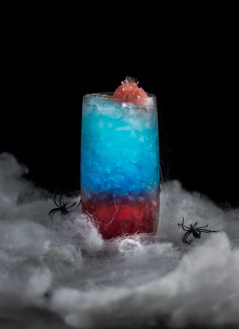 Layered Spiderman Cocktail Spiderman Cocktail, New Spiderman Movie, New Spiderman, Disney Cocktails, Layered Drinks, Dark Food Photography, Dragon Glass, Chocolate Lava, Chocolate Lava Cake