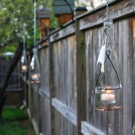 PRICES MAY VARY. RUSTIC GLASS BOTTLE DECOR: Add some decorative lantern lighting to any indoor or outdoor space with our hanging wine bottle indoor/outdoor lanterns. They're made of a metal frame and a 750ml glass bottle candle holder. Our wine bottle lights act as awesome outdoor hanging decorations for any garden, patio, yard, balcony, deck, or porch! WIDE APPLICATION: Our votive candle holders can be used for more than just fall outdoor decorations or indoor/outdoor lighting. These candle con Wine Bottle Lanterns, Wine Bottle Candle Holder, Clear Wine Bottle, Bottle Candle Holder, Blue Wine Bottles, Hanging Candle Lanterns, Wine Bottle Wind Chimes, Tea Candle Holders, Empty Wine Bottles