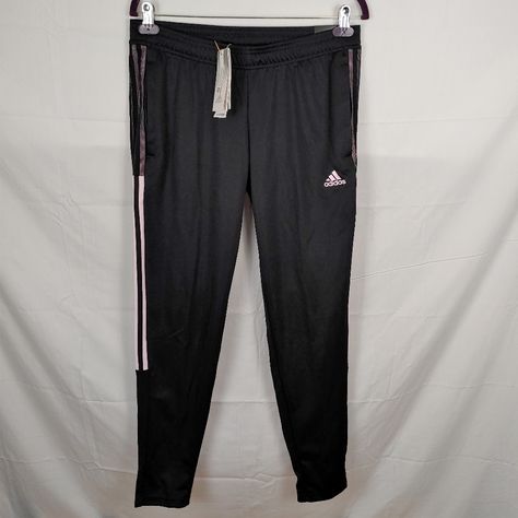 Adidas Tiro Aeroready Womens Football / Soccer Black & Pink Track Pants Size M - New With Tag - Size Medium - Relaxed Fit; Elastic Waist With Drawcord - 100% Recycled Polyester Doubleknit, Moisture Absorbing - Front Zip Pockets - Tapered Legs; Ankle Zips Introducing The Adidas Tiro Womens Track Pants, Your New Go-To For Working Out Or Just Hanging Out. These Pants Are Designed With Comfort And Style In Mind, With A Tapered Fit And Sweat-Wicking Aeroready Fabric. They're Also Made With Recycled Materials, So You Can Feel Good About Wearing Them Knowing That You're Helping The Environment. Whether You're Hitting The Gym Or Just Running Errands, These Pants Will Keep You Feeling Comfortable A Womens Track Pants, Pink Track Pants, Track Pants Women, Womens Football, Pink Adidas, Football Soccer, Tapered Legs, Recycled Materials, Adidas Women