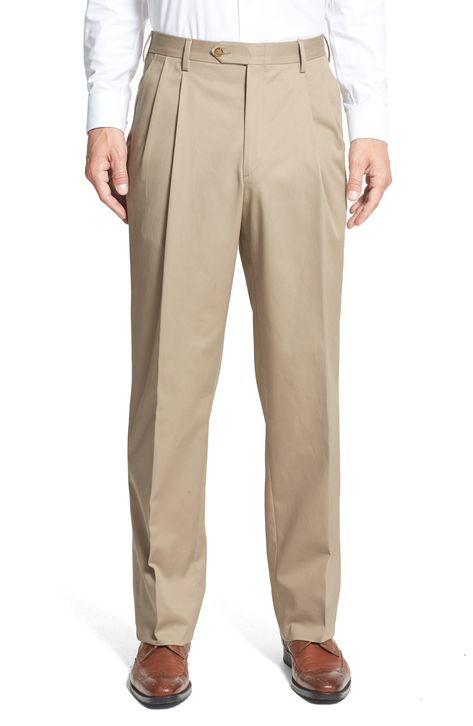 A classic pleated cut styles sharp cuffed trousers fashioned from soft, wrinkle-resistant cotton. 19" leg opening; 12" front rise; 18" back rise (size 34x30). Zip fly with hook-and-bar closure. Front slant pockets; back button-closure welt pockets. 100% cotton. Machine wash cold, tumble dry low. By Berle; imported. Men's Clothing. Cuffed Trousers, Uniform Pants, Men Suit, Men Trousers, Mens Dress Pants, Trouser Style, Pants Design, Pleated Pants, Dress Trousers