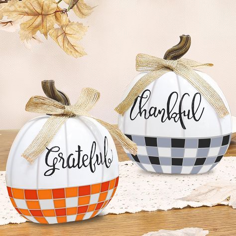 PRICES MAY VARY. Resin 2 Pack Tabletop Fall Pumpkin Decor: The package includes 2 plaid bow designed fall pumpkin decor, each measuring 5in L*3in W*6in H, decorated with bows and engraved with the words "Thankful" and "Grateful." Suitable for fall home decor Classic Plaid Bow Fake Pumpkins: resin material; buffalo plaid design, one in classic black, white and gray, the other in vibrant red, orange, and white. Linen bows add a rustic charm to the overall look Lightweight & Sturdy Thanksgiving Dec Thanksgiving Dec, Thanksgiving Crafts Decorations, Resin Pumpkin, Table Centerpieces For Home, Fall Pumpkin Decor, Fake Pumpkins, Artificial Pumpkins, Creative Pumpkins, Pumpkin Thanksgiving