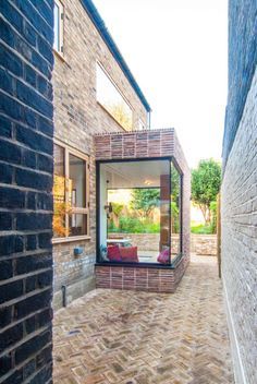 A minimal side extension and a full internal refurbishment see a beautiful palette of varying brick layouts with a huge corner glazing panel. Small House Extensions, Long Narrow Kitchen, House Extension Plans, Side Extension, Van Der Straeten, Narrow Kitchen, Room Extensions, Glass Extension, Corner Window