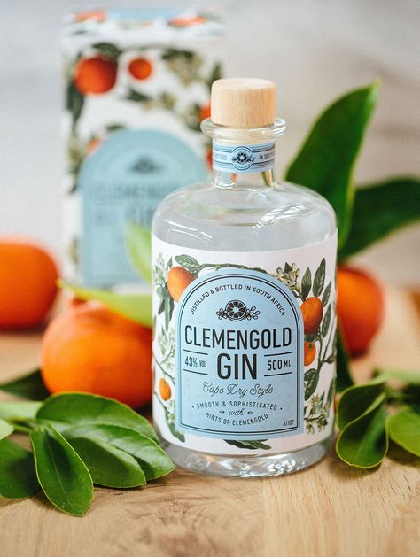 ClemenGold Gin is hand crafted according to an age-old recipe. Classic Cape Dry style, it is smooth with subtle hints of citrus complementing almond and cinnamon. Excellent in a refreshing gin and tonic, it also is good in the classic gin cocktails. Pot… Bottle Of Gin, Classic Gin Cocktails, Infused Gin, Gin Brands, Gin Bottle, Craft Gin, Bottle Design Packaging, Alcohol Packaging, Gin Bottles