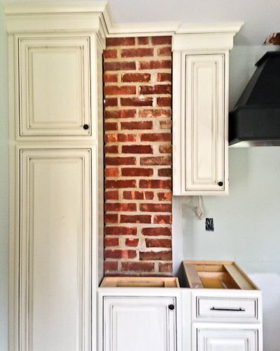 Exposed brick in a kitchen. Brick Columns Interior Kitchen, Chimney In Kitchen, Exposed Chimney, Country Kitchen Remodel, Kitchen Exposed Brick, Exposed Brick Kitchen, Kitchen Brick, Colonial Kitchen Remodel, Historic Kitchen