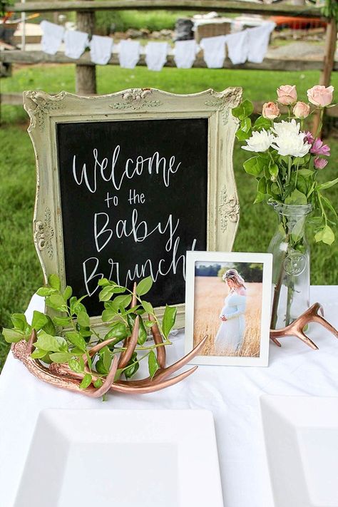 Our Frame #16 with custom hand-lettering accented by our Rose Gold Antlers creates a lovely welcome table for this surprise baby brunch! Welcome Table Baby Shower Ideas, Baby Shower Entrance Table, Baby Shower Seating Ideas, Baby Shower Welcome Table, Tea Party Baby Shower Theme, Baby Lunch, Baby Brunch, Baby Table, Storybook Baby Shower