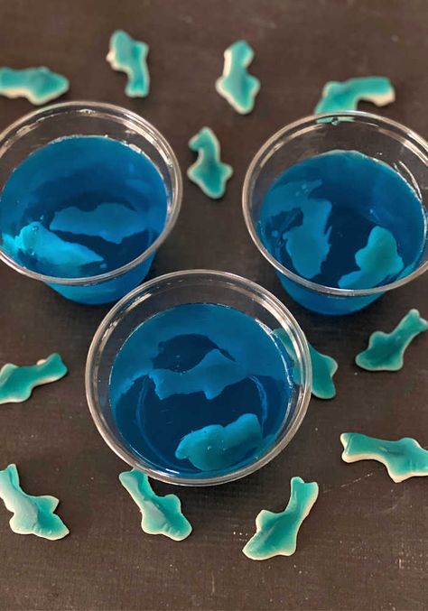 Jello With Gummy Sharks, Under The Sea Jello, Shark Jello Cups, Shark Themed Food, Gummy Shark, Surf Birthday Party, Nemo Birthday Party, Shark Week Party, Finding Nemo Birthday