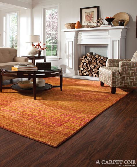 Orange is unexpected in this space. It really works well with the dark hardwood floors. Rug from Oriental Weavers' Expressions Collection. Orange Carpet, Living Room Orange, Dark Wood Floors, Floor Area Rugs, Inviting Home, Yellow Area Rugs, Orange Area Rug, Beautiful Living Rooms, Orange Rugs