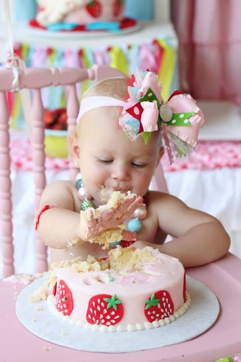 Strawberry Smash cake.  Note the cute headband and necklace - no shirt to help with the mess!  Love it. Sweet One Strawberry Smash Cake, Smash Cake Strawberry First Birthdays, Smash Cake Strawberry Theme, Strawberry First Birthday Cake Smash, Strawberry Birthday Smash Cake, Berry Sweet One First Birthday Smash Cake, Berry Sweet 1st Birthday Smash Cake, Berry Themed First Birthday Cake, Strawberry Theme Smash Cake