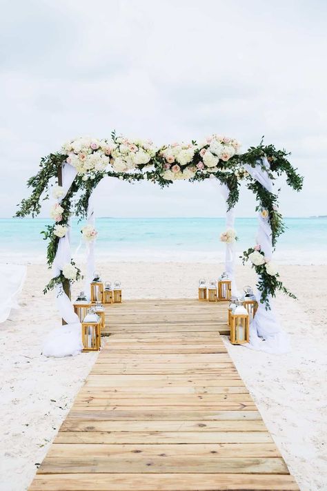 Gorgeous ceremony at Emerald Bay Beach Exuma. Photo: Dana Lynn Photography. #beachwedding #beachweddingideas #beachweddingarch #beachweddingdecor #beachweddingarch #bahamaswedding #weddingarch Beach Wedding Ceremony Arch, Wedding Walkway, Beach Wedding Planning, Beach Wedding Aisles, Exuma Bahamas, Bahamas Wedding, Wedding Ceremony Arch, Caribbean Wedding, Wedding Beach Ceremony