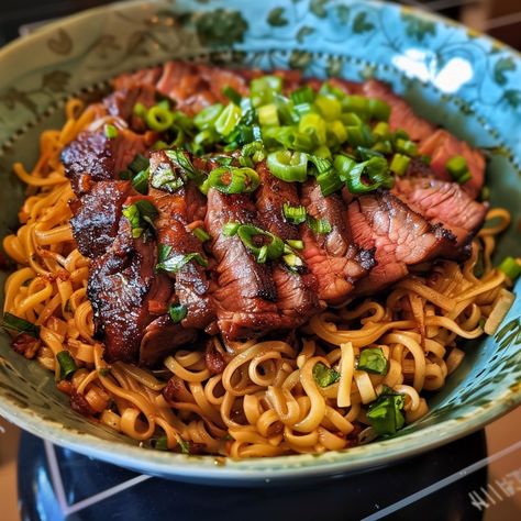 A Flavor-Packed Meal! These Garlic Soy Steak Noodles combine the savory flavors of marinated steak with the umami richness of a soy-based sauce and the satisfying chewiness of noodles. Garnished with fresh green onions and cilantro, this dish is both beautiful and delicious. Share this recipe on Facebook to inspire your friends and family to try this flavor-packed meal at home! 🍜🥩🌿✨ Garlic Soy Steak Noodles Ingredients: For the Steak: 1 pound flank steak or ribeye steak 2 tablespoons soy sa... Steak Pasta Dishes, Expensive Meals, Steak Noodles, Ramen Noodles With Steak, Steak And Ramen Noodles, Ramen Noodle Recipes Steak, Meal Inspiration, Steak And Pasta, Flank Steak And Noodles Recipes