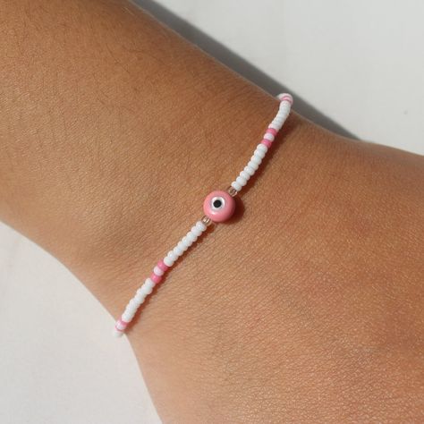 Pink Evil Eye Bracelet | Dainty Evil Eye, Evil Eye Beads, Seed Bead Bracelets, Evil Eye Beaded Bracelets, Beaded Anklet, Stretch Bracelets Evil Eye Bracelet Ideas, Bracelets Evil Eye, Pink Evil Eye, Braided Bracelet Diy, Minimal Bracelet, Handmade Evil Eye, Evil Eye Beads, Bracelets Beaded, Good Luck Bracelet