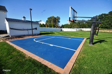 This basketball court was installed in Shoreham NY. 25x25 with golden brown nicolock 6x9 rustico border and asphalt installed over recycled concrete base. We installed a regulation adjustable hoop and a spot light. The court was painted with a color known as performance blue and the key was striped in a white color. This is Gappsi`s latest project. Gappsi is a full backyard designer from landscaping, masonry and gunite and vinyl swimming pools, home remodeling and construction, synthetic turf, Concrete Basketball Court Backyard, Artificial Grass Basketball Court, Backyard Basketball Court Size, Old Basketball Court, Asphalt Basketball Court, Vinyl Swimming Pool, Recycled Concrete, Synthetic Turf, Sport Court